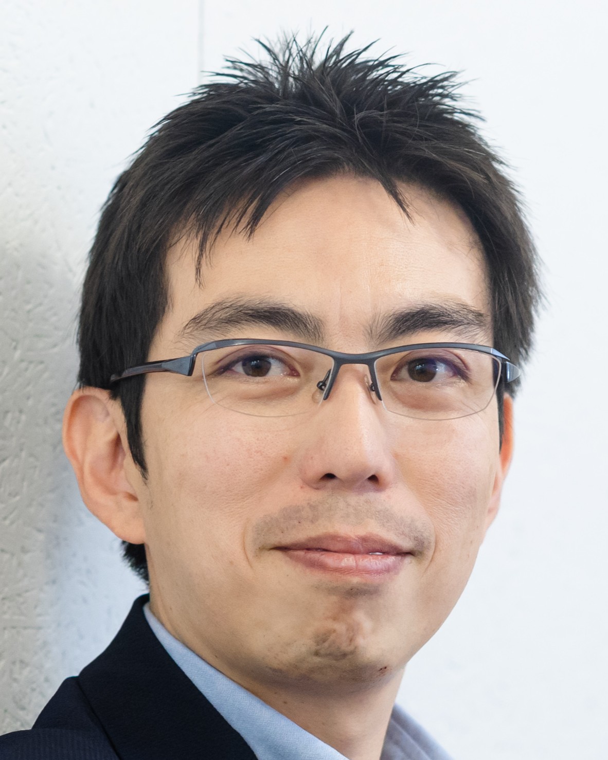 程塚 正史氏